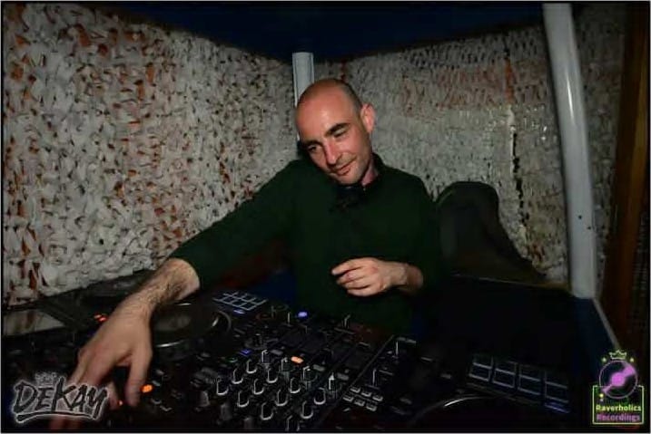 Boule mixing on a DJ console in a booth