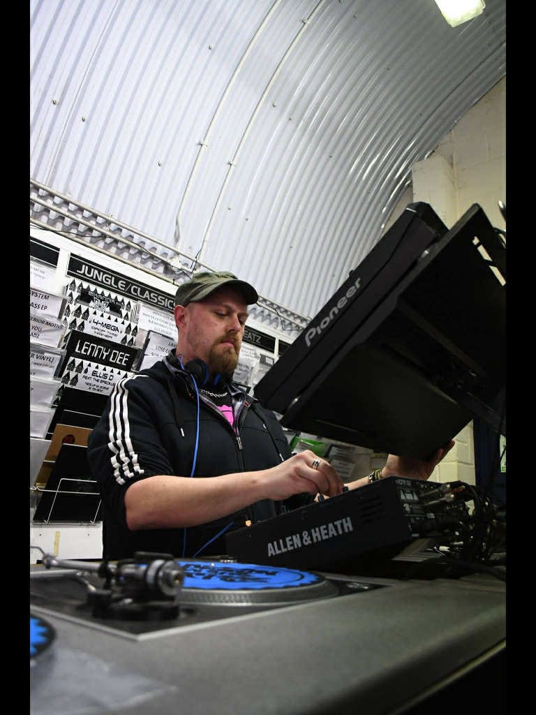 FriedEggBeats mixing on an Allen and Heath console in a studio